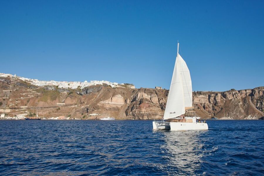 Santorini Gold Catamaran Cruise with Snorkel, BBQ & Open Bar - White Beach and the Venetian lighthouse