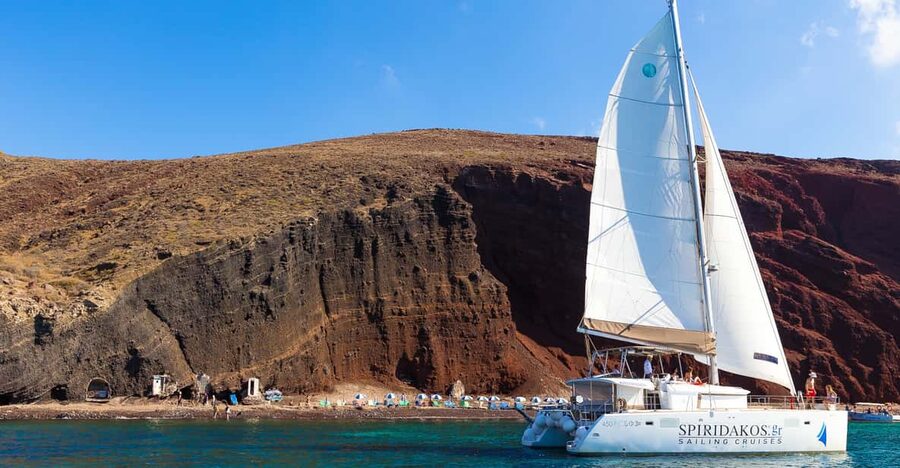 Santorini: Sailing Catamaran Cruise with BBQ and Drinks - Red Beach and White Beach show Santorini’s geology