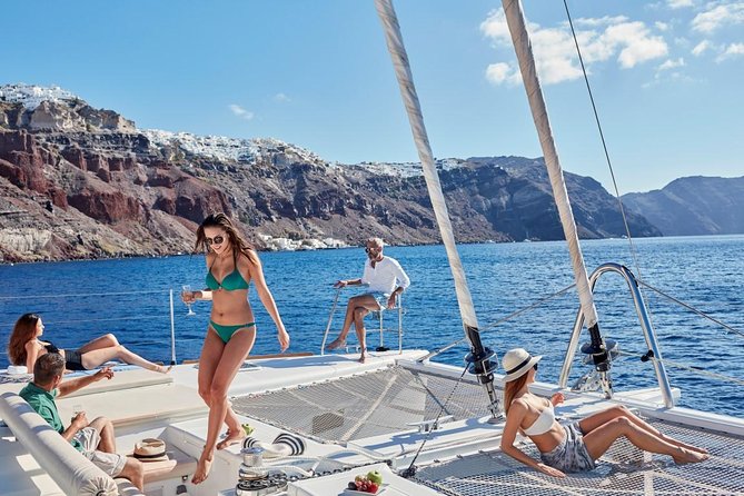 Santorini Sunset Luxury Sailing Catamaran Cruise with BBQ, drinks, transfer - Hotel pickup and the start at Vlychada Port