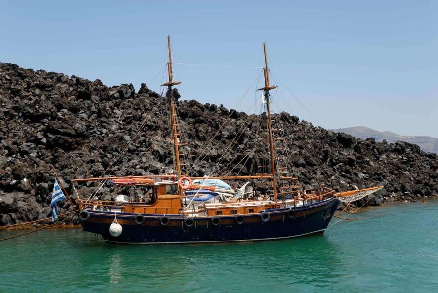 Santorini: Thirassia Islands and Volcano Guided Cruise - Walking across the black rock of Nea Kameni