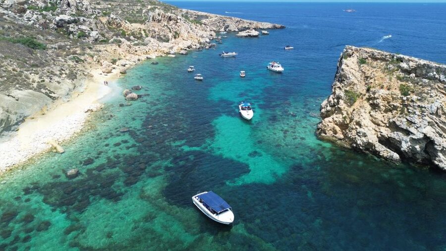 Sliema: Boat Trip to Comino Blue Lagoon, Gozo, and Caves - Ħalfa Rock in Gozo: a different setting for swimming