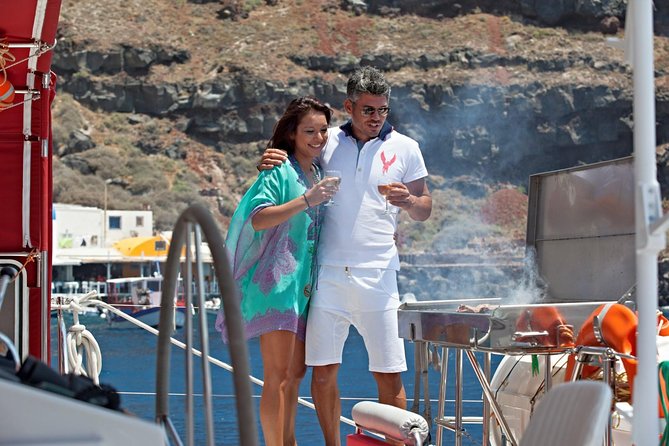Sunset Sailing Catamaran Cruise in Santorini with BBQ and Drinks - Setting out from Ammoudi or Athinios Port