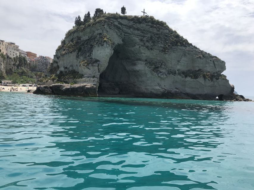 Tropea: Capo Vaticano Boat Trip with Snorkeling & Drink - The boat, crew, music, and atmosphere